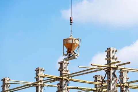 Worker working in construction on blue sky Stock Photos