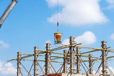 Worker working in construction on blue sky Stock Photos