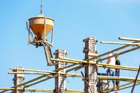 Worker working in construction on blue sky Stock Photos