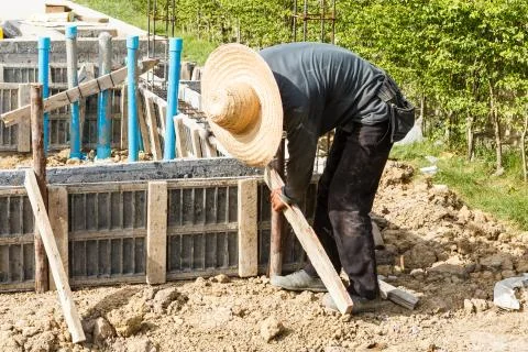 Worker working on construction site Stock Photos