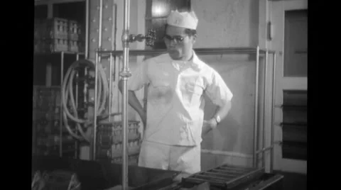 Worker working with crate at Blue Seal Dairy plant Stock Footage 37595847