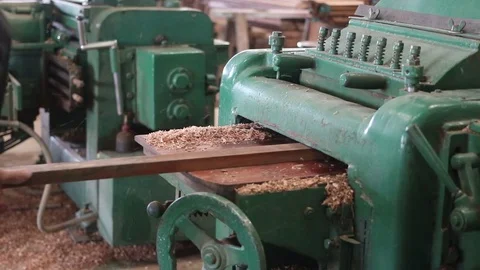 Worker is working with electric planer of wood machine. Stock Footage 79669187