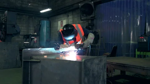 The worker working in the factory via the welding machine. 스톡 동영상 142950409