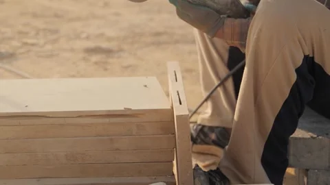 The worker is working with a grinder and tiles 動画素材 268717950