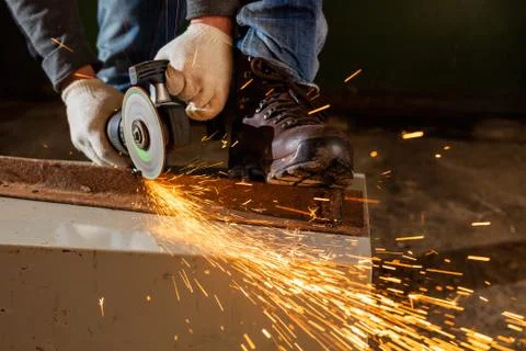 Worker working of a grinding machine Stock Photos