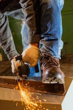 Worker working of a grinding machine Stock Photos