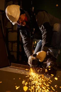 Worker working of a grinding machine Stock Photos