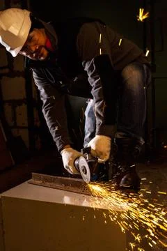 Worker working of a grinding machine Stock Photos