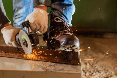 Worker working of a grinding machine Stock Photos