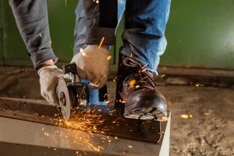 Worker working of a grinding machine Stock Photos