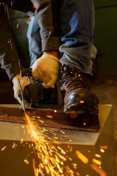 Worker working of a grinding machine Stock Photos