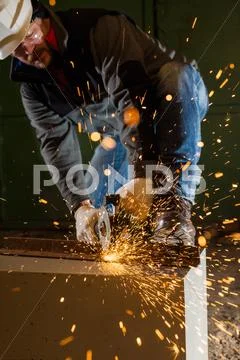Worker Working Of A Grinding Machine