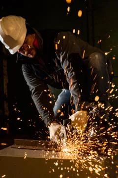 Worker working of a grinding machine Stock Photos