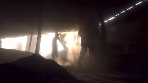 A worker working hard inside a dark room. Stock Footage 172854013