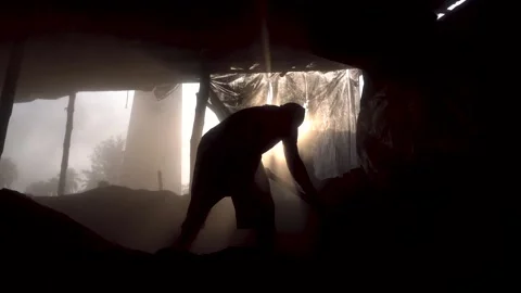 A worker working hard inside a dark room Stock Footage 172855054