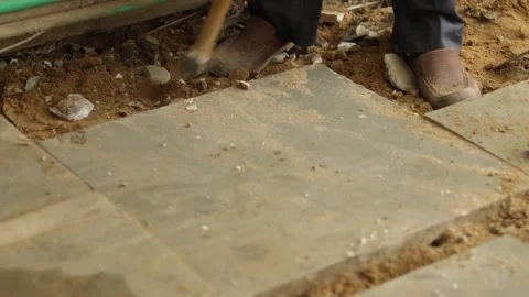 Worker working hard, removing tiles, using hammer and chisel Stock Footage 245092812