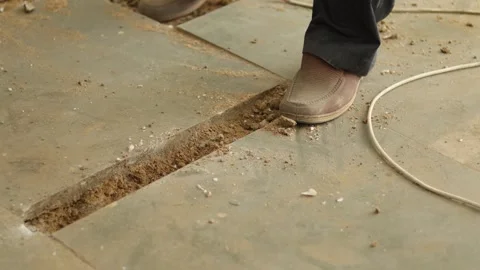 Worker working hard, removing tiles, using hammer and chisel Stock Footage 245092827