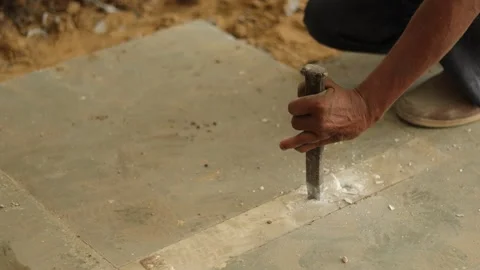 Worker working hard, removing tiles, using hammer and chisel. Stock Footage 245092966