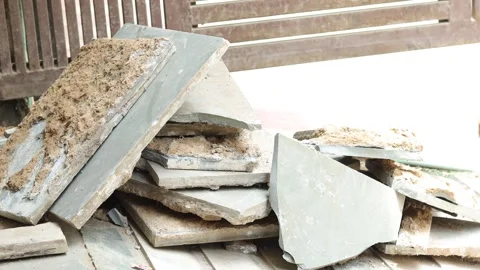 Worker working hard, removing tiles, keeping aside tiles. Stock Footage 245094034