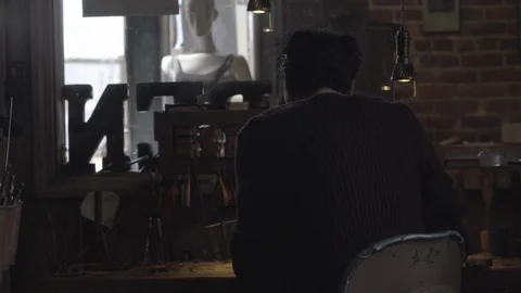 Worker working on his workdesk at workshop Stock Footage 87613161