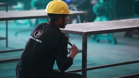 Worker working with hummer in metal table in factory  Stock Footage 305993554