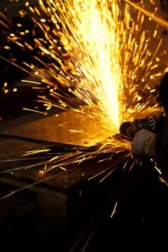 Worker working in industry or factory is holding a cutting stone grindin stone Foto stock