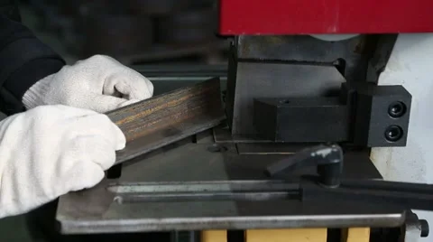 Worker working with metal on a hydraulic press mode guillotine Stock Footage 47858978