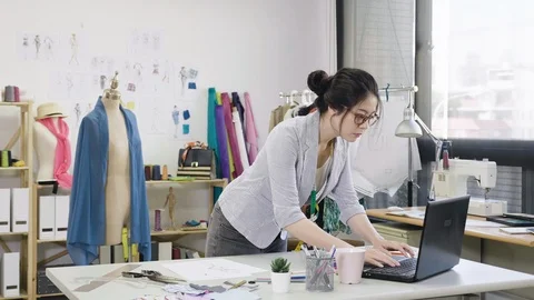 Worker working with papers paintings and laptop Stock Footage 111947957
