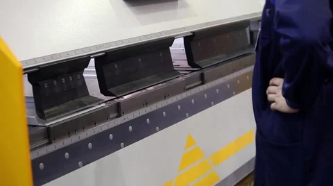 Worker is working on sheet metal bending machine Stock Footage 52084007