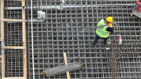 Worker Working on Steel Mesh Reinforcement and Construction Preparatio Stock Footage 333008224