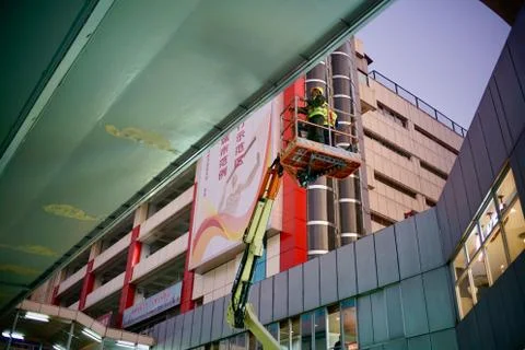 Worker working at working platform at Height. Stock Photos