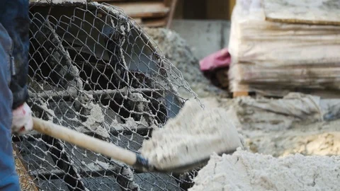 Worker works on construction. Sand Stock Footage 120481892