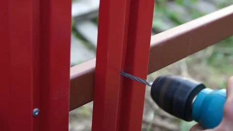 The worker works with a drill Stock Footage 80331412