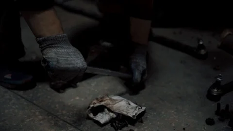 The worker works in a garage Stock Footage 98450590