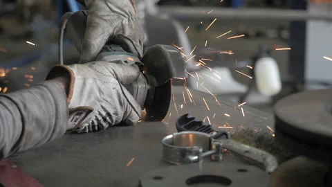A worker works with grinder. Hands of workman cutting metal detail with grinder Stock Footage 139288717