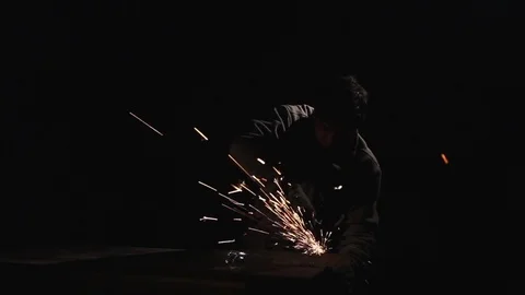 Worker works with grinder machine Stock Footage 70618363