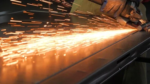 Worker works on the grinder. Slow motion. Stock Footage 107034395