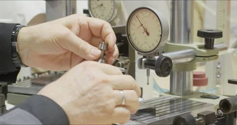 Worker works with precision measuring instruments at metalworking plant Stock Footage 171570720