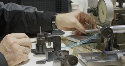 Worker works with precision measuring instruments at metalworking plant Stock-Footage 171570988
