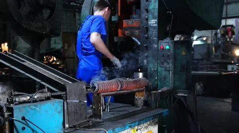 Worker works on a punching machine. Stock Footage 49432289