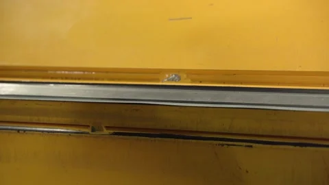 A worker works on a sheet bending machine from the inside and bends the sheets Stock Footage 277594915