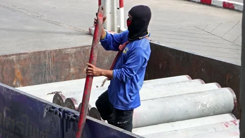 A worker works on a truck bed Stock Footage 223356356