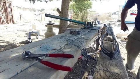 A worker works with a wire. Stock Footage 77290113