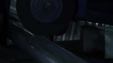 Worker in the workshop cutting metal pipe with a lathe Stock Footage 237802855