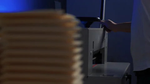 Worker in the workshop, the production of notebooks. Paper production Stock Footage 141413877