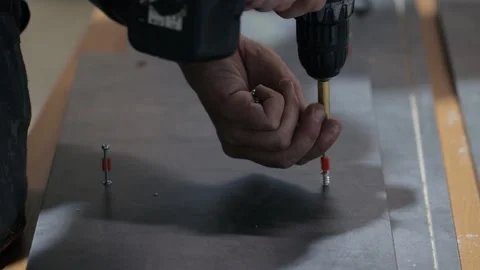 Worker in workshop working with сordless screwdriver Video stock 133358950