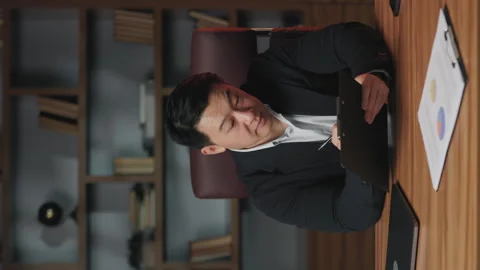 Worker writing down creative solution to problem in office Stock Footage 246825922