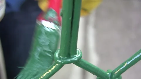 Worker with yellow gloves, protective, painted with a brush short, a wrought  Video stock 59843149