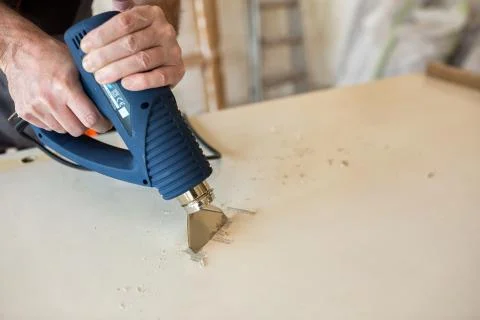 Workerr repairs the door in a carpenter's workshop 写真素材