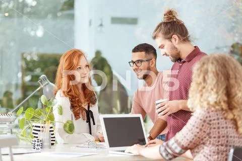 Workers at advertising agency Stock Photos